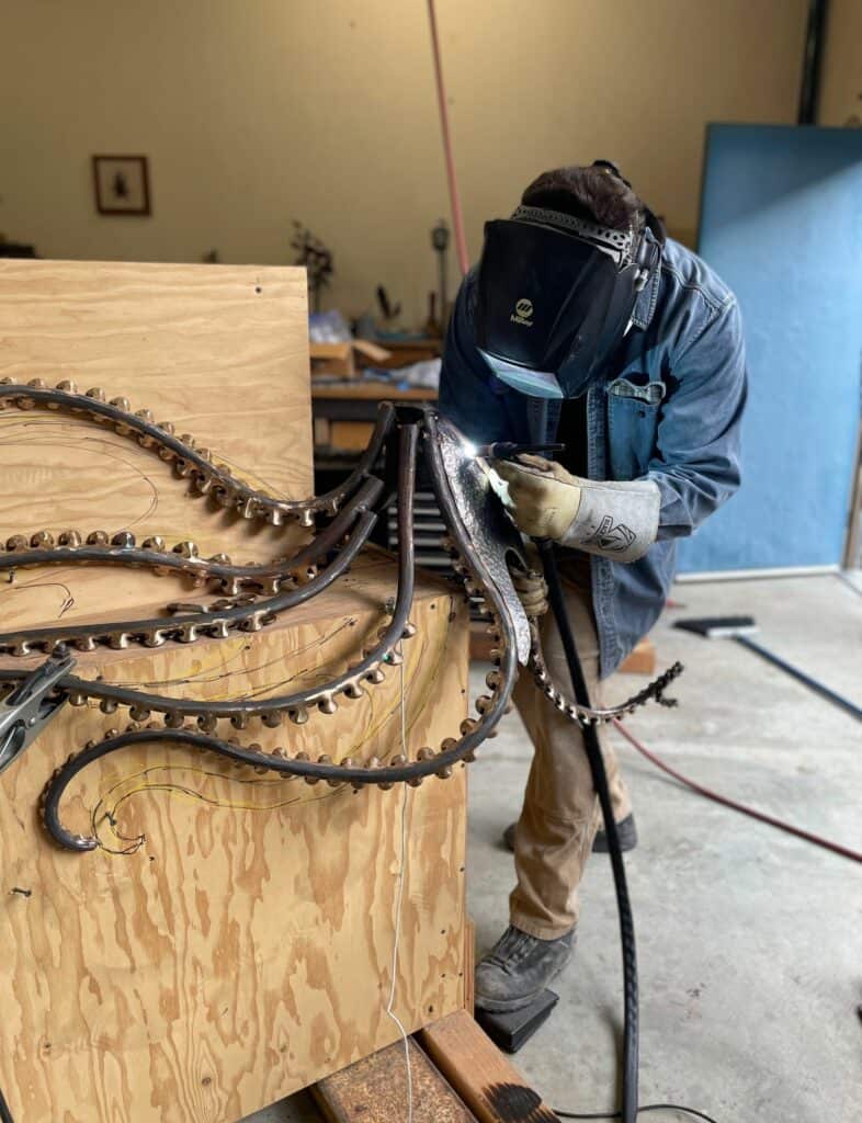 welding octopus legs to art sculpture